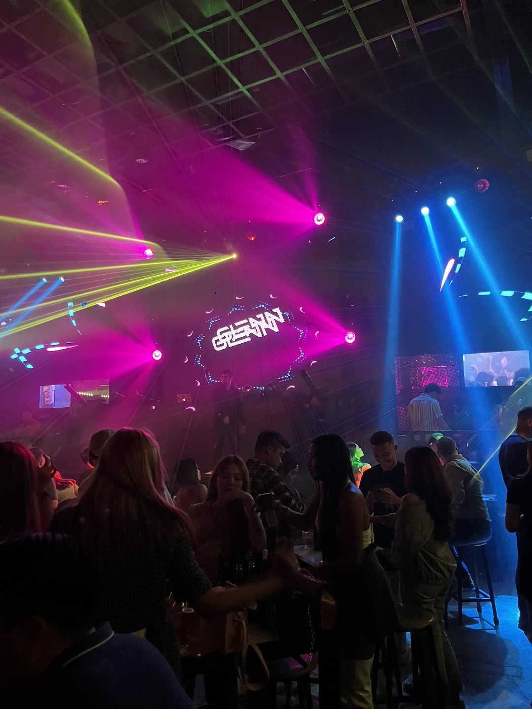 Vibrant nightclub interior with colorful laser lights in Cebu Philippines